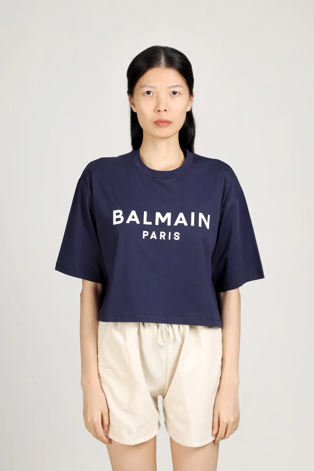 BALMAIN Women Balmain Paris Flocked Logo Cropped T-Shirt in Navy/White Eco-Designed Cotton 1