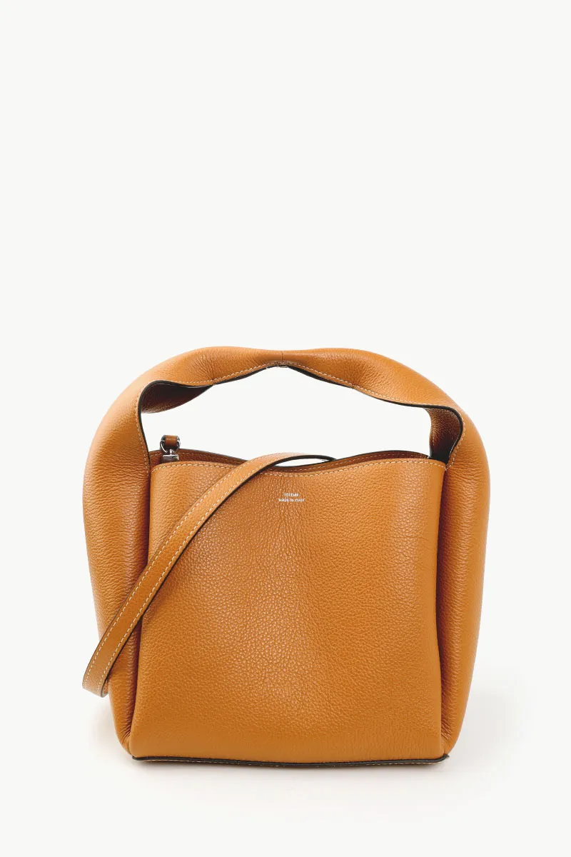 TOTEME Logo Print Cubic Bucket Bag in Tan Supple Grained Leather with Shoulder Strap 0