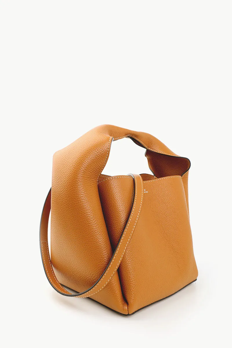 TOTEME Logo Print Cubic Bucket Bag in Tan Supple Grained Leather with Shoulder Strap 1