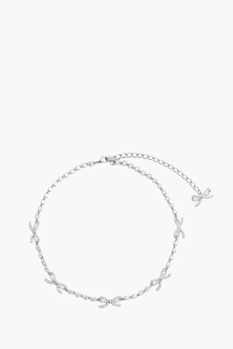 SELF-PORTRAIT Crystal Bow Necklace in Grey Brass Stone